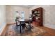 Traditional home office includes a stylish rug and a wood bookcase for storage at 4030 Palisades Main Nw, Kennesaw, GA 30144