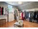 Large walk-in closet featuring custom shelving and an abundance of hanging space at 4030 Palisades Main Nw, Kennesaw, GA 30144