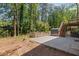 Backyard features a spacious patio area, storage shed, and a staircase to the elevated deck at 4232 Rue Saint Dominique, Stone Mountain, GA 30083