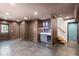 Finished basement with tile floors, a kitchenette, and access to an outdoor patio at 4232 Rue Saint Dominique, Stone Mountain, GA 30083