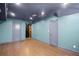 Finished basement with wood flooring, recessed lighting, and painted doors and trim at 4232 Rue Saint Dominique, Stone Mountain, GA 30083