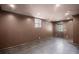Unfinished basement room featuring tile flooring, recessed lighting, and an egress window at 4232 Rue Saint Dominique, Stone Mountain, GA 30083
