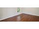 Cozy room featuring hardwood floors, neutral walls, base trim and a window at 4232 Rue Saint Dominique, Stone Mountain, GA 30083