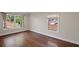 Bright room featuring hardwood floors, neutral walls, base trim and large windows at 4232 Rue Saint Dominique, Stone Mountain, GA 30083