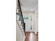 Foyer with hardwood floors and a staircase with metal spindles at 4232 Rue Saint Dominique, Stone Mountain, GA 30083