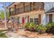 Inviting front porch with a red door, brick facade and wood-accented railings and shutters at 4232 Rue Saint Dominique, Stone Mountain, GA 30083