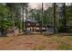 Charming two-story home with a double door garage, nestled in a lush, wooded lot at 4232 Rue Saint Dominique, Stone Mountain, GA 30083