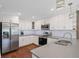 Bright kitchen featuring shaker cabinets, stainless appliances, and quartz countertops at 4232 Rue Saint Dominique, Stone Mountain, GA 30083