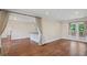 Bright living room featuring hardwood floors and open layout to the kitchen at 4232 Rue Saint Dominique, Stone Mountain, GA 30083