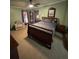 Comfortable main bedroom with a queen bed, dresser, and natural light at 6650 George Ct, Cumming, GA 30041