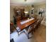Traditional dining room with a large wooden table and hutch with kitchen access at 6650 George Ct, Cumming, GA 30041