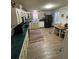 Bright eat-in kitchen with a breakfast table and a contrasting black refrigerator at 6650 George Ct, Cumming, GA 30041