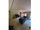 Cozy living room with a neutral carpet, ceiling fan, and plenty of natural light at 6650 George Ct, Cumming, GA 30041