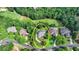 Aerial view of home showcasing its lush surroundings and proximity to golf course at 7050 Redcliff Ct, Suwanee, GA 30024