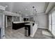 Finished basement with a granite countertop island, wooden floors, recessed lighting, and barstool seating at 7050 Redcliff Ct, Suwanee, GA 30024