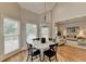 Bright breakfast nook offers hardwood floors, natural light, and an open floorplan at 7050 Redcliff Ct, Suwanee, GA 30024