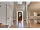 Grand foyer showcasing hardwood floors, elegant details, and an abundance of natural light at 7050 Redcliff Ct, Suwanee, GA 30024