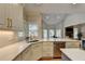 Bright kitchen with granite countertops, stainless steel appliances, and white cabinets at 7050 Redcliff Ct, Suwanee, GA 30024