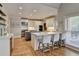 Beautiful kitchen with stainless steel appliances, quartz countertops, and an island with bar seating at 7050 Redcliff Ct, Suwanee, GA 30024