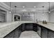 Featuring granite countertops and custom cabinets, this stylish kitchen offers ample counter space at 7050 Redcliff Ct, Suwanee, GA 30024