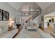 Spacious living room showcases hardwood floors, staircase, and neutral color palette at 7050 Redcliff Ct, Suwanee, GA 30024