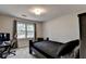 Bedroom featuring a bed, desk, and chair, perfect for a home office or study area at 1132 Owen Cir, Sugar Hill, GA 30518