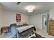 Bedroom featuring a comfortable bed, carpeted floor, and a window offering natural light at 1132 Owen Cir, Sugar Hill, GA 30518