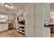 Well-designed kitchen with ample storage in the tall cabinets and modern appliances at 1132 Owen Cir, Sugar Hill, GA 30518