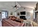 Spacious living room featuring vaulted ceilings, a fireplace, and views to the entrance at 1132 Owen Cir, Sugar Hill, GA 30518