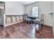 Bedroom with hardwood floors and a bright window, offering a serene and inviting atmosphere at 1527 Keeter Rd, Canton, GA 30114