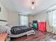 Bedroom with a large bed, hardwood floors, and natural light creating a serene and inviting space at 1527 Keeter Rd, Canton, GA 30114
