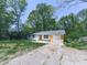 Modest home with freshly cut front yard, a single car garage and a concrete driveway at 1527 Keeter Rd, Canton, GA 30114