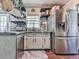 Kitchen featuring stainless steel appliances, a large refrigerator, and cabinetry at 1527 Keeter Rd, Canton, GA 30114