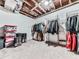 Spacious closet with industrial shelving, clothing racks, storage bins, and carpet flooring at 1017 Fairway Valley Dr, Woodstock, GA 30189