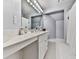 Bathroom featuring a vanity with double sinks and a large mirror at 1017 Fairway Valley Dr, Woodstock, GA 30189