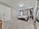 Bedroom with neutral walls, carpet, and closet at 1017 Fairway Valley Dr, Woodstock, GA 30189