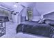 Bedroom featuring an angled ceiling, a dresser, and a plush bed at 1017 Fairway Valley Dr, Woodstock, GA 30189