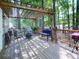 Relaxing wooden deck area with pergola, seating, and lush natural surroundings at 1017 Fairway Valley Dr, Woodstock, GA 30189