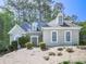 Charming single-Gathering home featuring stone accents and a well-maintained yard with mature trees at 1017 Fairway Valley Dr, Woodstock, GA 30189