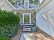 Close-up of the front door featuring stone accents, steps, and a well-manicured entrance at 1017 Fairway Valley Dr, Woodstock, GA 30189