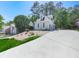 Charming home features stone accents, manicured landscaping, and a long driveway at 1017 Fairway Valley Dr, Woodstock, GA 30189
