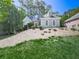 Charming home features stone accents, manicured landscaping, and a neatly maintained lawn at 1017 Fairway Valley Dr, Woodstock, GA 30189