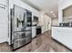 Kitchen featuring stainless steel refrigerator and appliances, white cabinets and granite countertops at 1017 Fairway Valley Dr, Woodstock, GA 30189