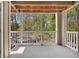 Screened-in balcony with views of surrounding trees at 110 Barrington Hills Dr # 110, Atlanta, GA 30350