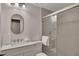 Well-lit bathroom featuring a modern vanity, oval mirror, and glass-enclosed shower at 110 Barrington Hills Dr # 110, Atlanta, GA 30350