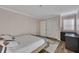 Bedroom with double closets and window with privacy shutters at 110 Barrington Hills Dr # 110, Atlanta, GA 30350