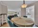 Inviting dining room with an oval table and seating adjacent to the kitchen and living area at 110 Barrington Hills Dr # 110, Atlanta, GA 30350