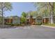 A condominium complex with ample parking and manicured landscaping. Serene and inviting community at 110 Barrington Hills Dr # 110, Atlanta, GA 30350