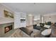 Inviting living room with a fireplace, built-in shelving, and wood floors at 110 Barrington Hills Dr # 110, Atlanta, GA 30350