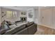 Open concept living room features a fireplace, built-in shelving, and wood floors at 110 Barrington Hills Dr # 110, Atlanta, GA 30350